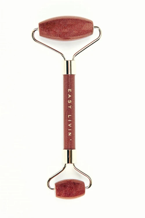 Roller Easy Livin do masażu twarzy z piasku pustyni w kolorze ceglanym z błyszcącymi refleksami